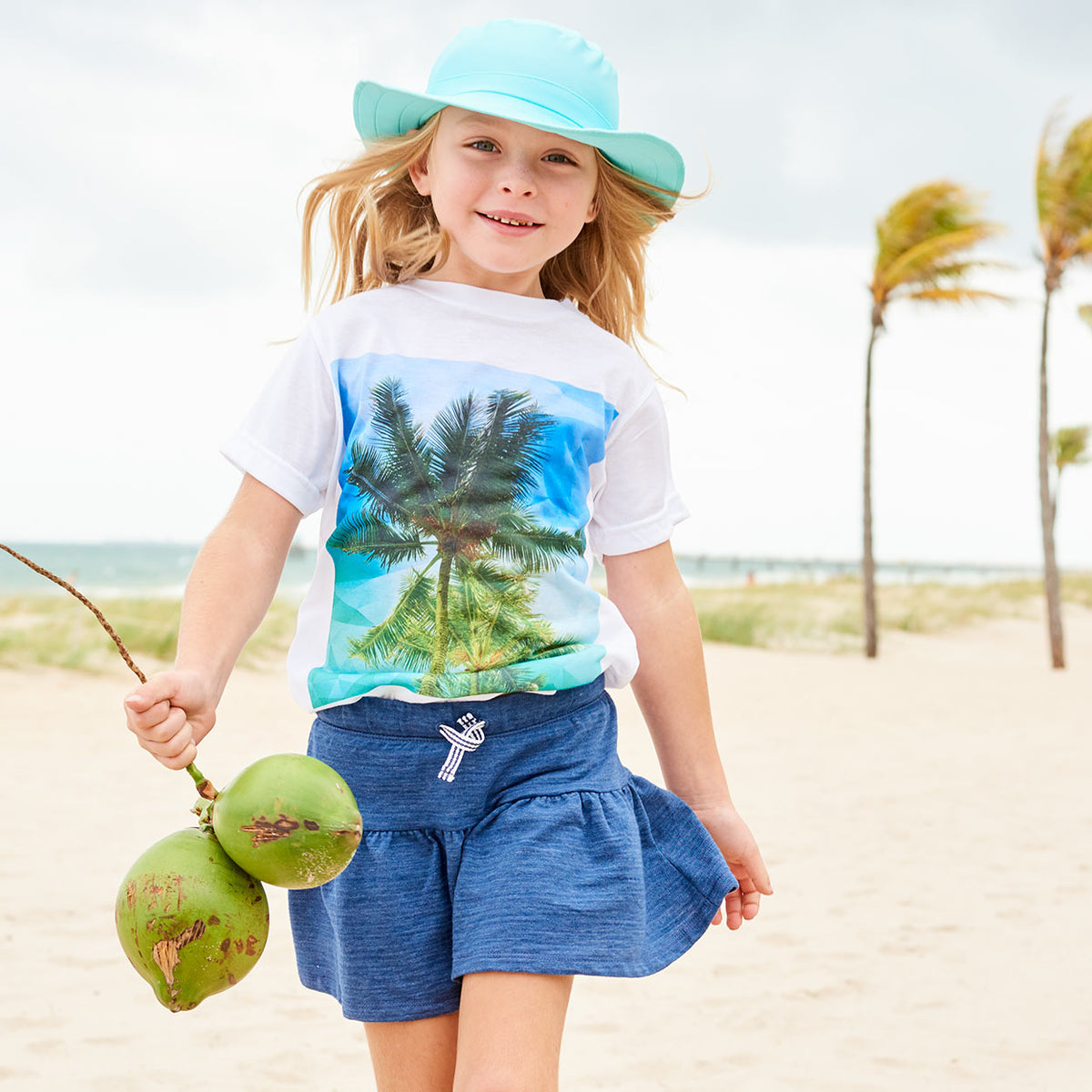 Kids Palms Graphic Tshirt White Green Blue Size Xs L Unisex Geo Tropical Girl Skipping On The Sand Holding Coconuts Sunpoplife