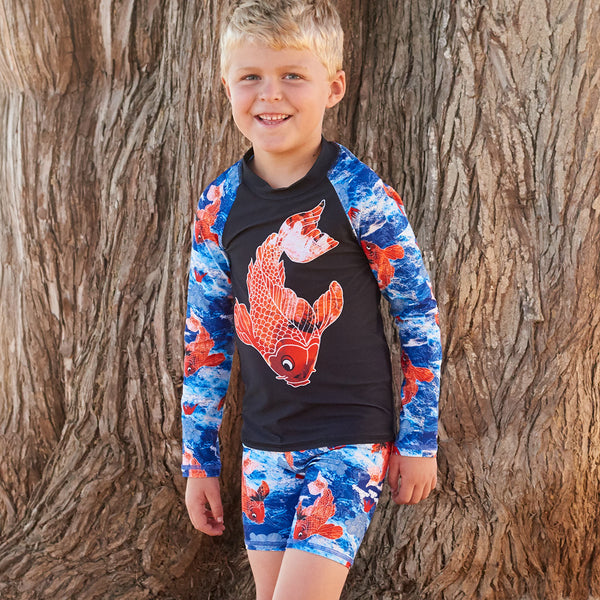 Koi Fish Long Sleeve Rash Guard Top Upf50 Kids Boys Size 2 12 Navy Blue Orange Happy Boy Leaning Against A Brown Tree Sunpoplife