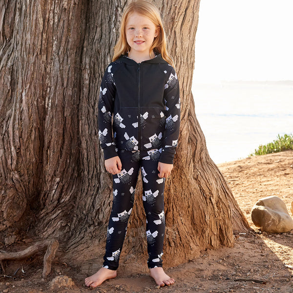 Owls Sunblocker Leggings Upf50 Black White Unisex Boys Girl Size 2 6 Girl Wearing An Athleisure Outfit Standing By The Beach Sunpoplife